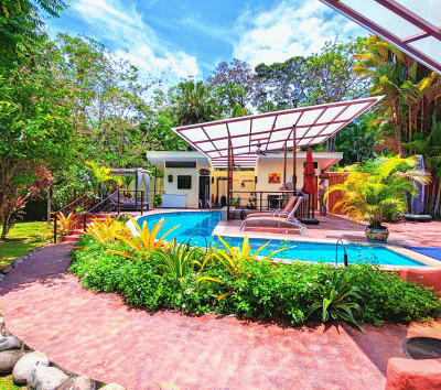 Turnkey home with guest studio, swim-up pool bar, short walk to the beach
